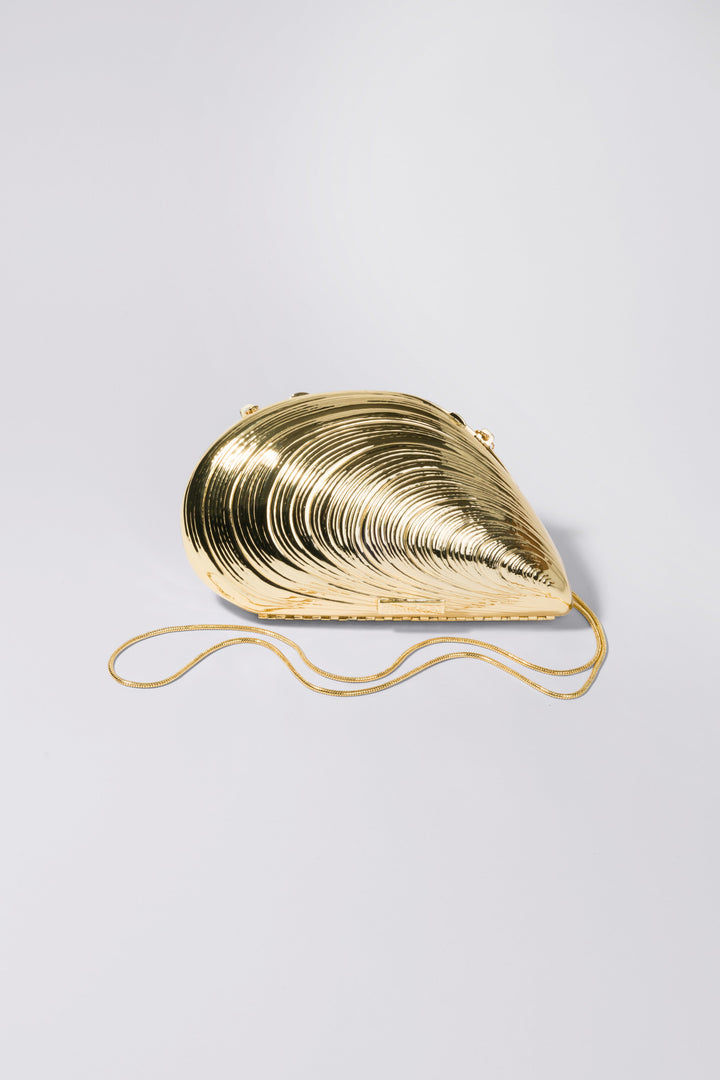 SIMKHAI - Bridget Metal Oyster Shell Clutch in Gold