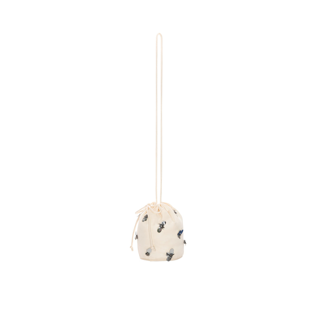 THE GREAT - The Cinched Paillette Bucket Bag in Cream