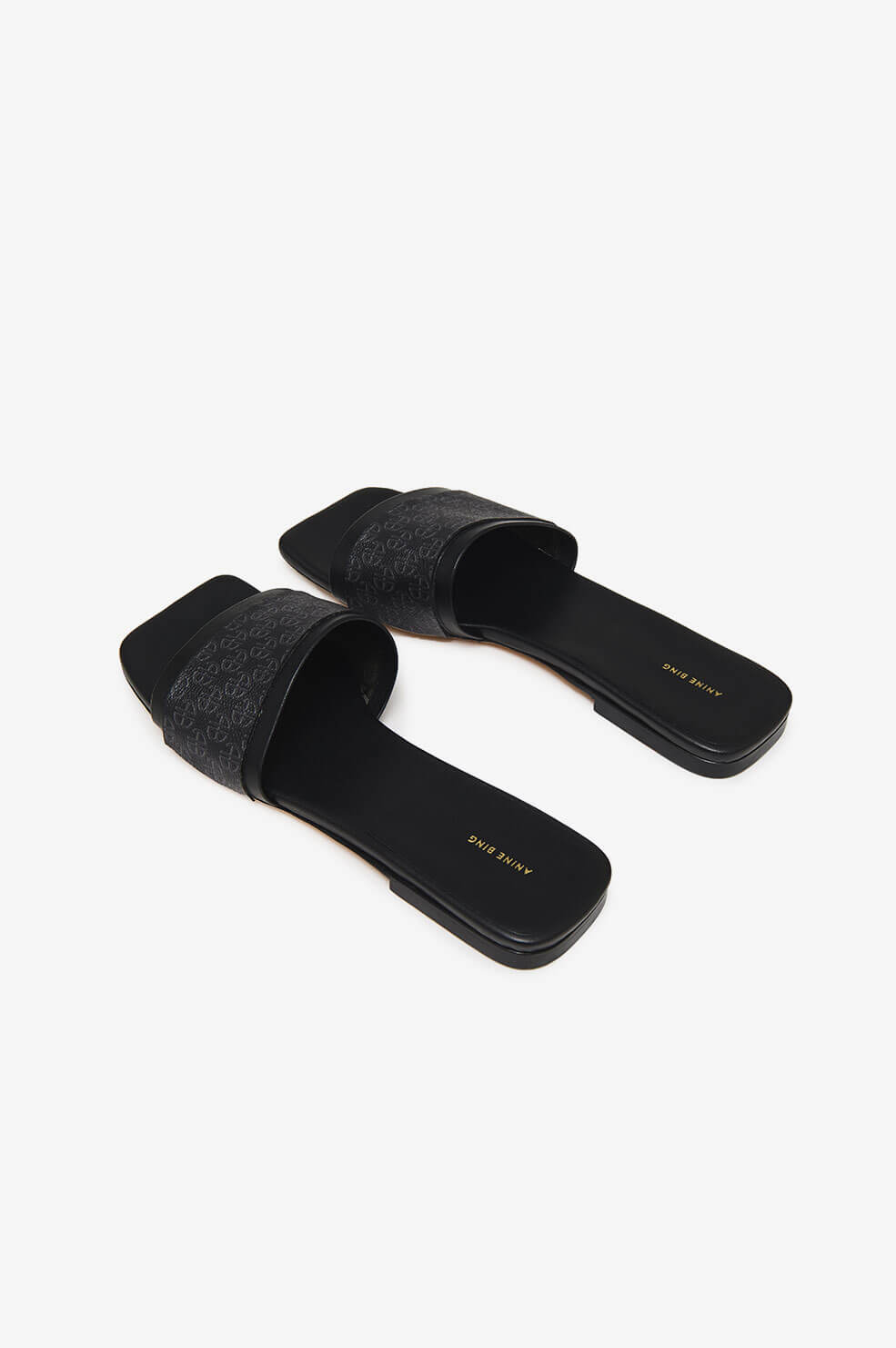 Anine Bing - Ria Slides in Black Monogram Print