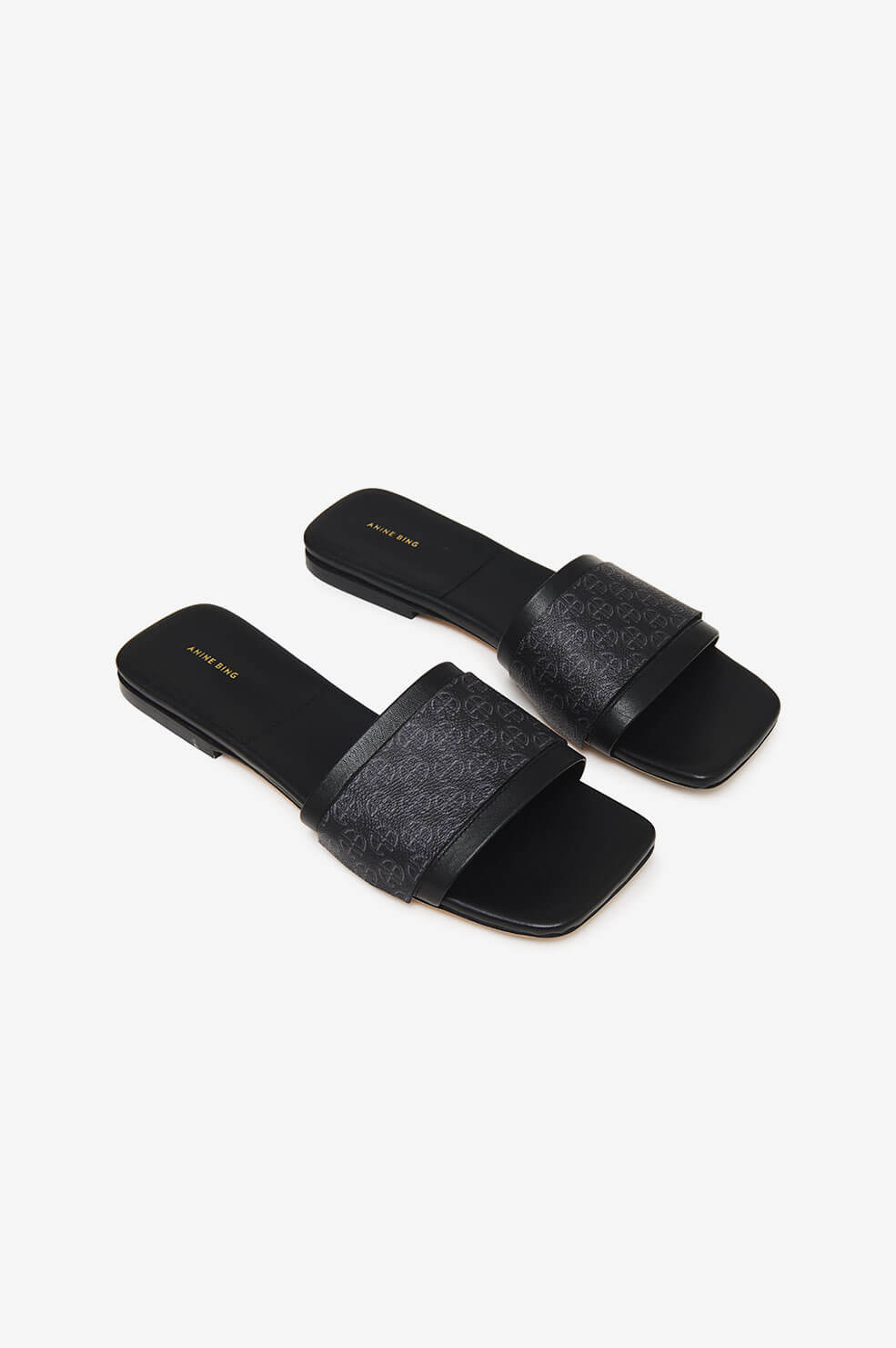 Anine Bing - Ria Slides in Black Monogram Print