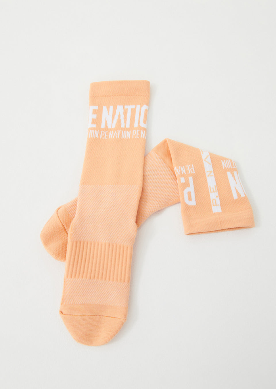 P.E NATION - Backline Socks in Orange Pale