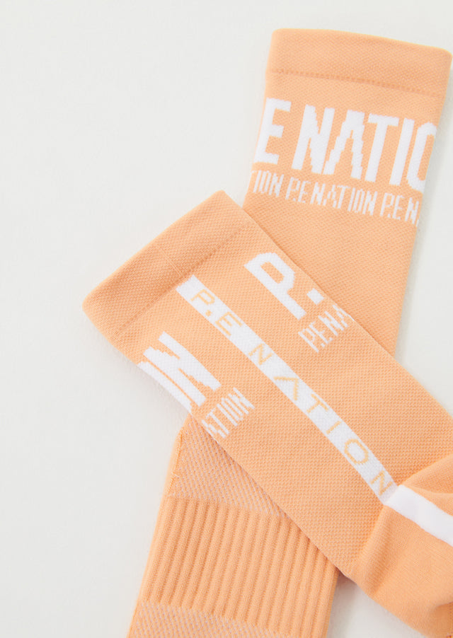 P.E NATION - Backline Socks in Orange Pale
