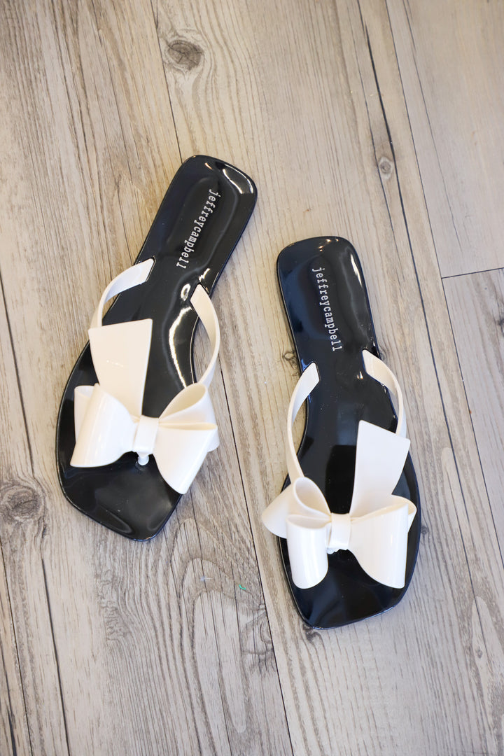 Jeffrey Campbell - Sugary Flat Jelly Bow Thong in Cream Shiny Black Shiny Shoes